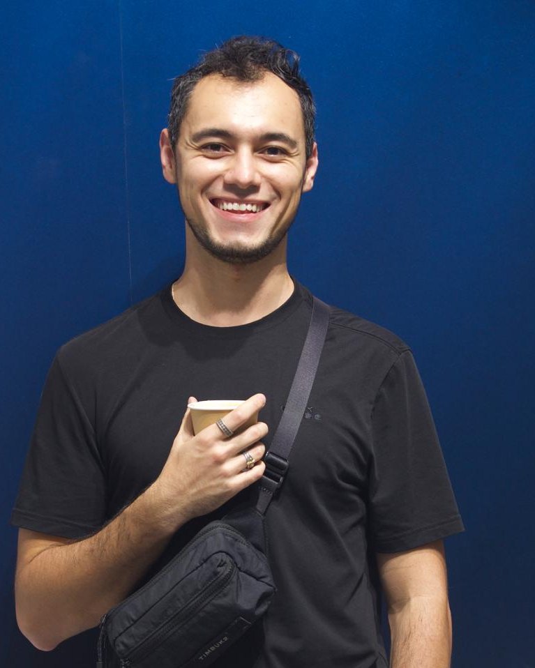 Juan Acosta, holding a coffee